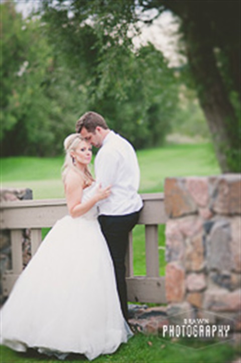 Wedding photo from Fox Hollow Golf Course on the bridge near the pavilion with photo courtesy of Brawn Photography